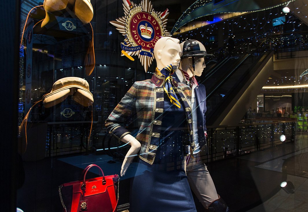 La Martina boutique in Prague featuring polo-inspired fashion and accessories, illuminated by ERCO LED spotlights.