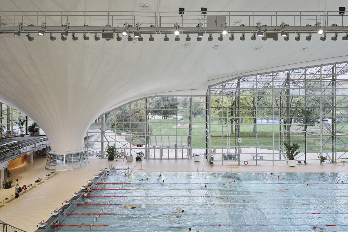 LED lighting at Munich's Olympic Park Aquatic Center, enhancing energy efficiency and visual comfort.