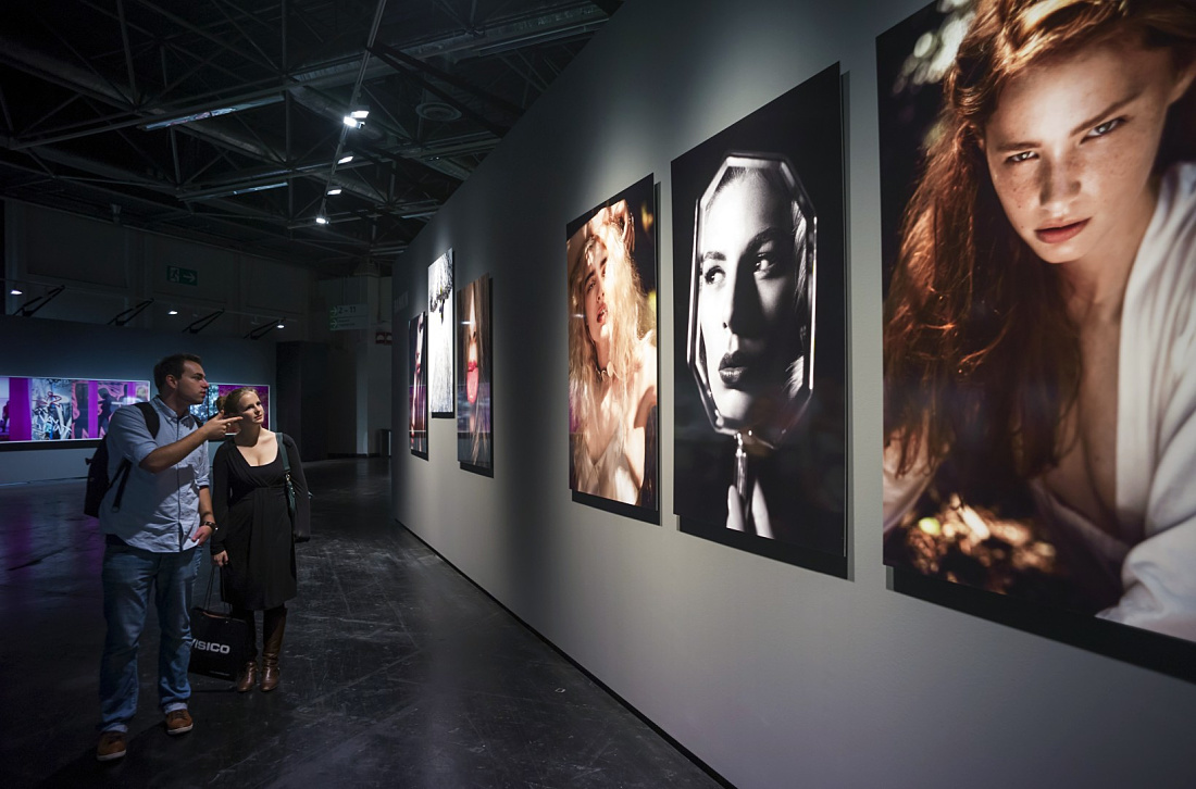 Visitors view the Leica photo gallery, illuminated by ERCO Light Board LED spotlights at Photokina 2012.