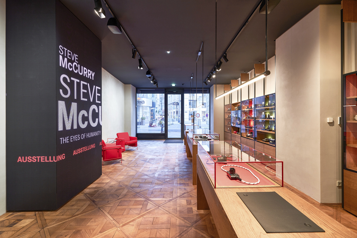 Leica Store Vienna featuring ERCO LED lighting for gallery and shop ambiance.