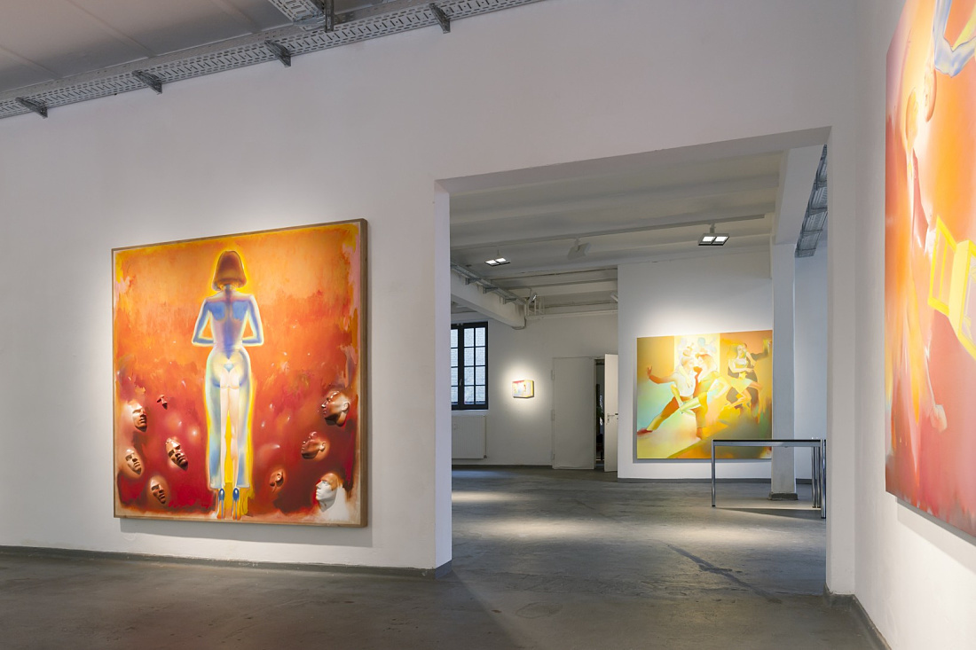 Levy Gallery exhibition featuring surreal art, illuminated by ERCO lighting.