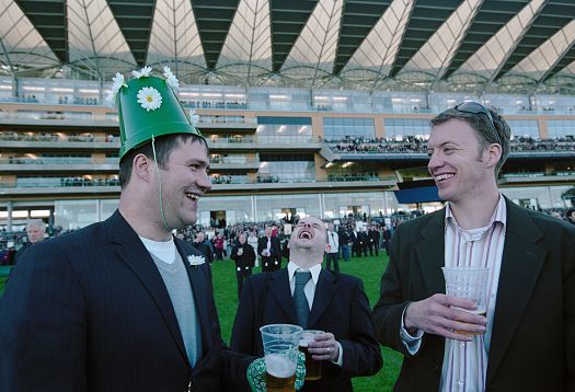 Laughing men with beer at Royal Ascot racecourse, photographed in context for ERCO.