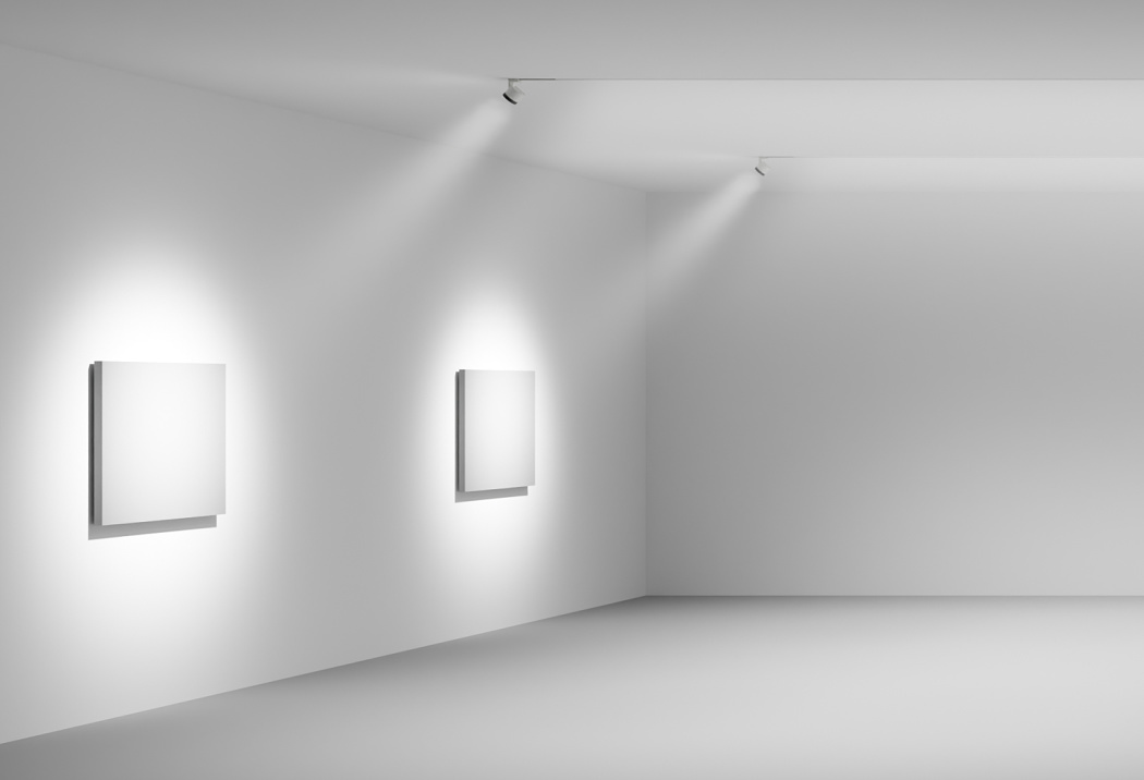 ERCO LED light structures illuminate artwork in a gallery, enabling flexible lighting design.