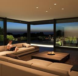 ERCO spotlights illuminate an accent wall in a living space, creating a cozy reading nook.