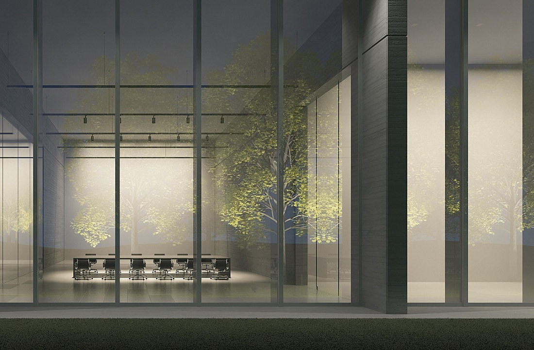 ERCO lighting in a glass-walled conference room with trees, emphasizing the connection between indoor and outdoor spaces.