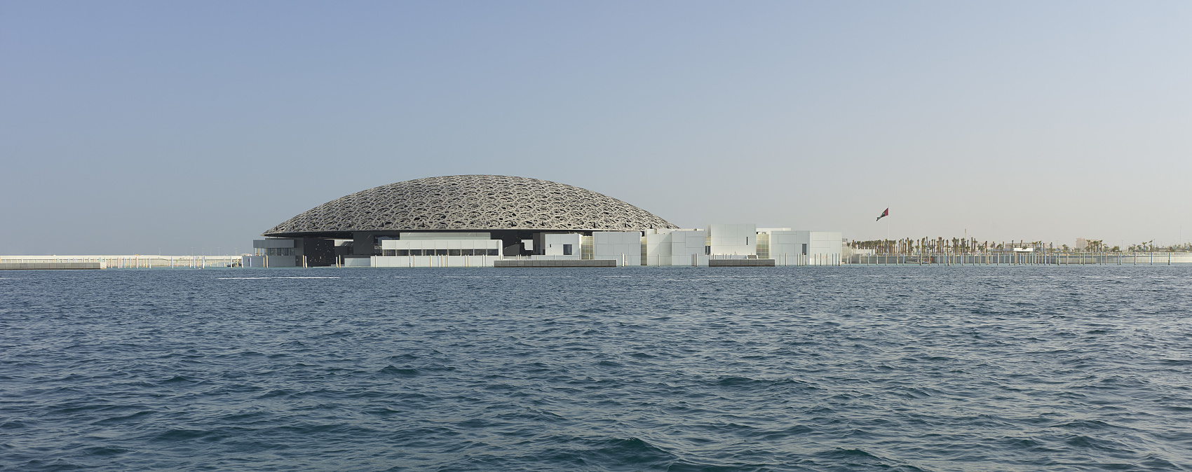 Louvre Abu Dhabi museum featuring its iconic dome, illuminated by ERCO LED lighting.