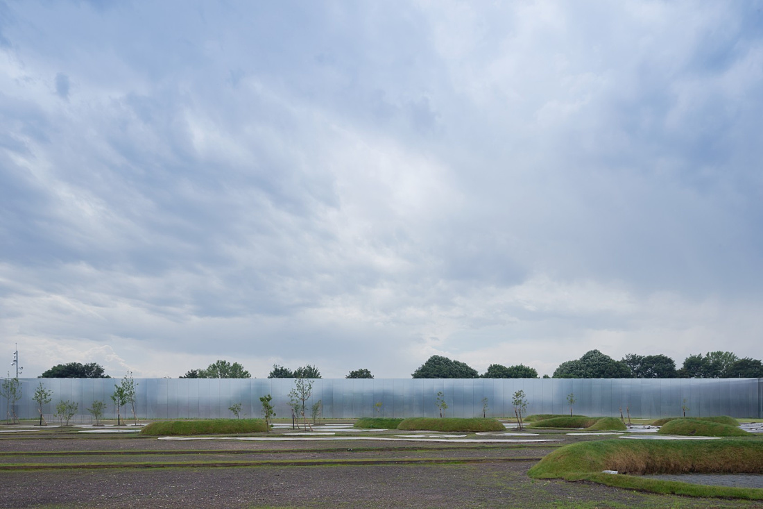 Louvre Lens Museum exterior featuring ERCO LED lighting and landscape design.