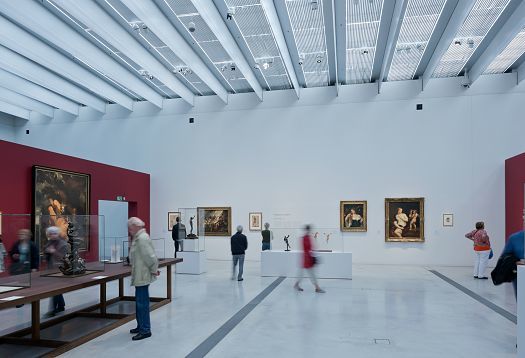 Interior of the Louvre-Lens Museum featuring art and visitors, illuminated by ERCO LED lighting.