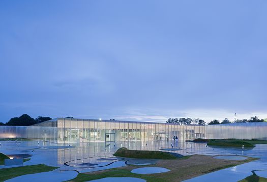 Louvre-Lens Museum at dusk, designed by SANAA, featuring ERCO lighting for de luxe transparency.