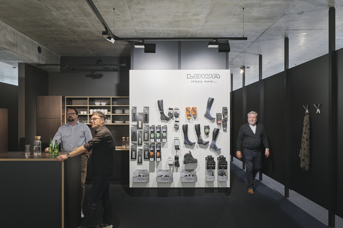 Lowa showroom featuring ERCO office lighting, designed for flexible workspaces and product displays.