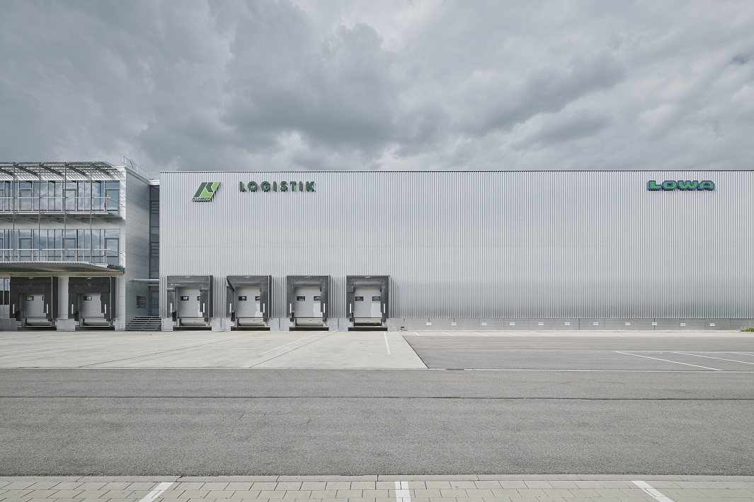 Lowa Logistics Center: Functional building for outdoor specialists with efficient LED lighting.