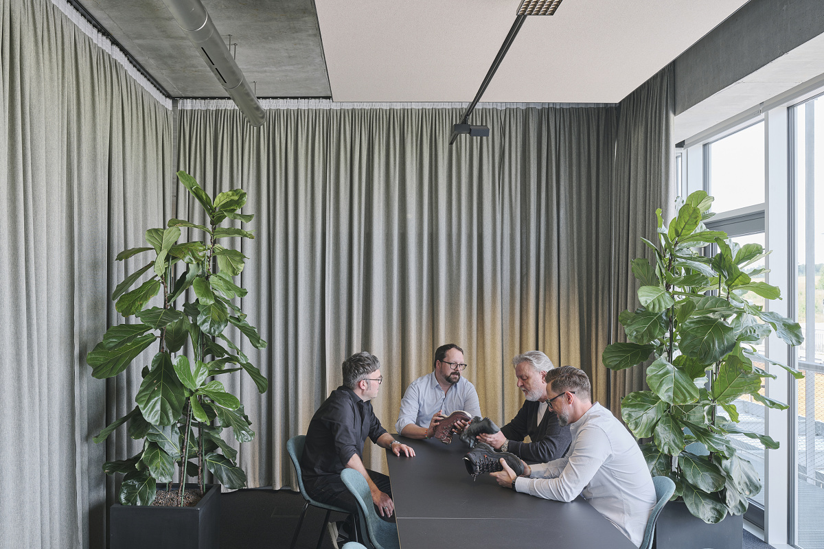 Lowa office meeting room featuring ERCO office lighting for visual comfort and product presentation.
