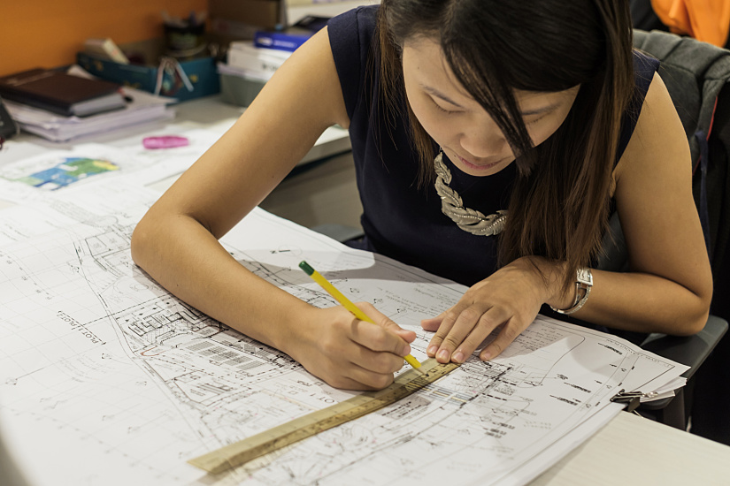LuxLight employee working on a lighting plan with ERCO luminaires.