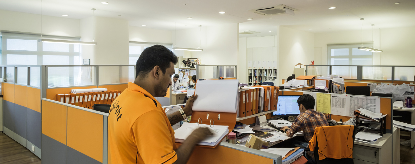 LuxLight office in Singapore featuring ERCO LED lighting enhancing the orange corporate identity.