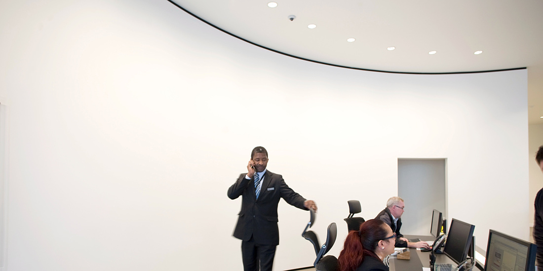Mace HQ foyer with Quintessence LED wallwashers, showcasing a prestigious entrance.