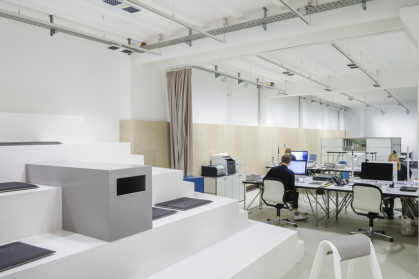 mai public relations' loft office featuring ERCO Jilly downlights for flexible office lighting.