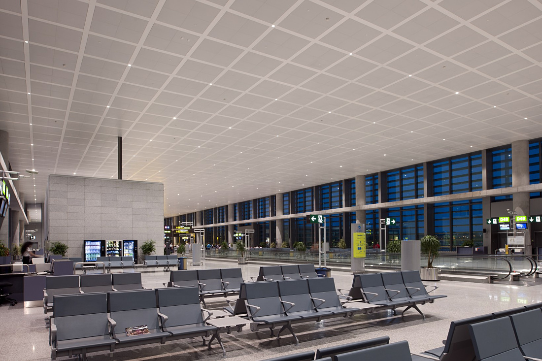 Malaga Airport Terminal 3 waiting area, featuring efficient ERCO Lightcast downlights.