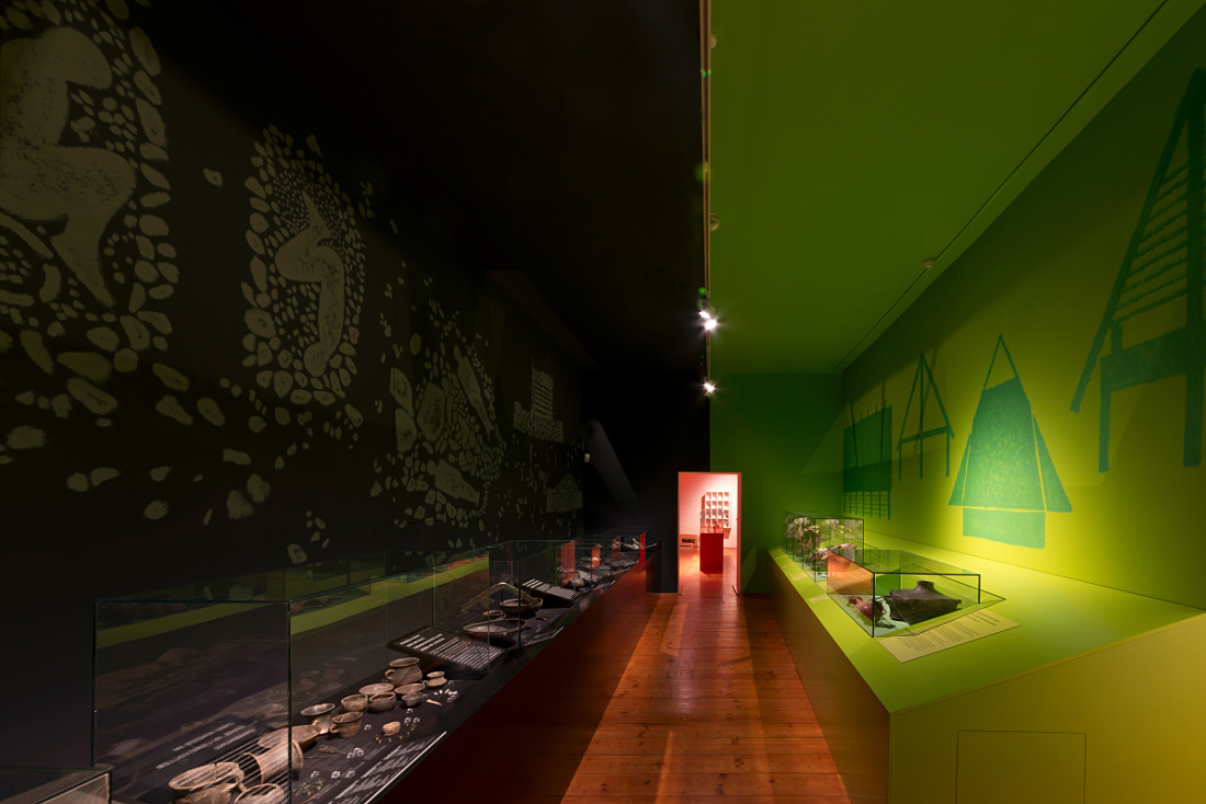 MAMUZ Museum Mistelbach: Interactive exhibit featuring ERCO lighting for prehistoric artifacts.