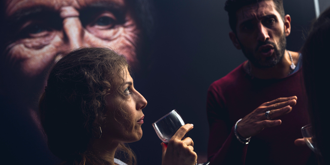 Visitors view Matthew Penn's hyper-realistic art, illuminated by ERCO spotlights in Barcelona.
