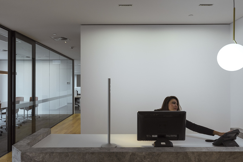 Reception area featuring ERCO lighting for visual comfort in a modern Sydney office.
