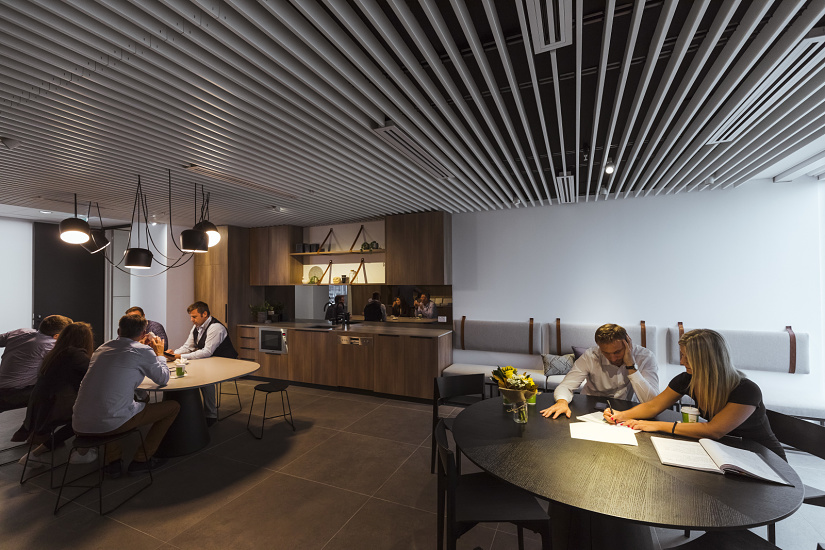 Modern Sydney office space featuring ERCO Compar linear luminaires for visual comfort and minimalist design.