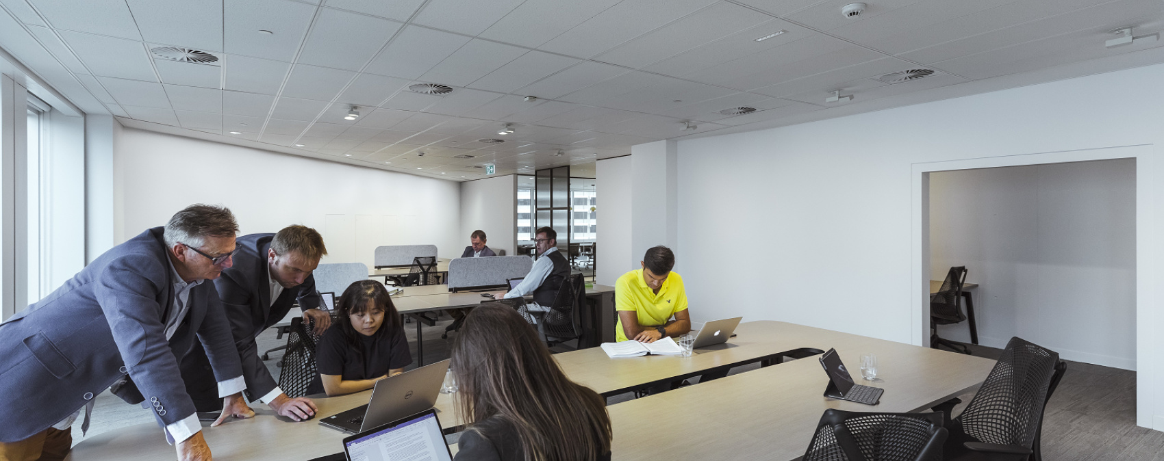 ERCO Compar linear luminaires providing visual comfort and minimalist design in a modern office.