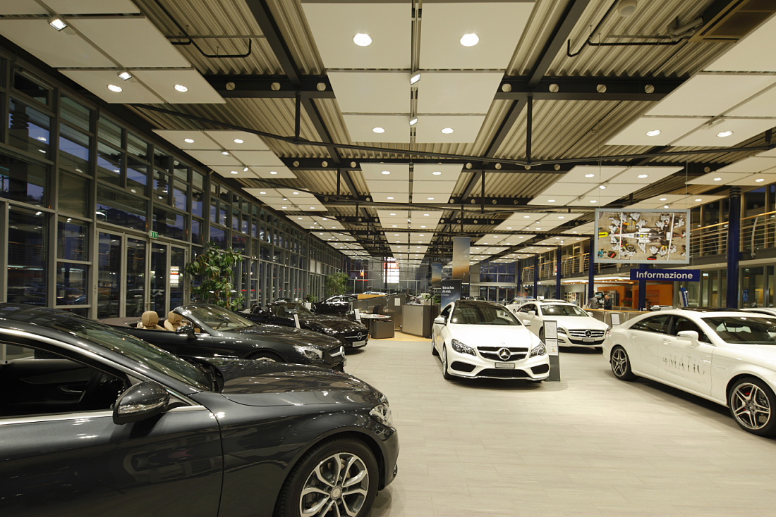 Mercedes showroom in Lugano, featuring ERCO LED lighting for car presentation.