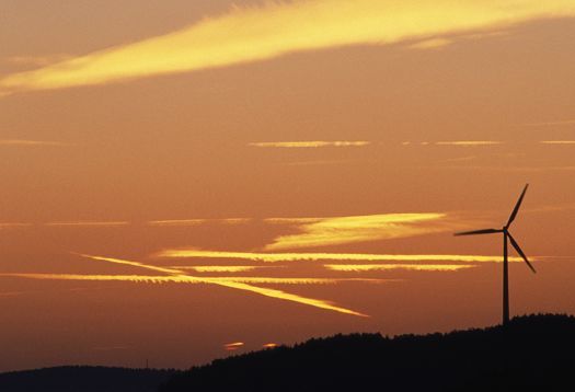 Wind turbine at twilight: Transition from day to night vision, affected by luminance.