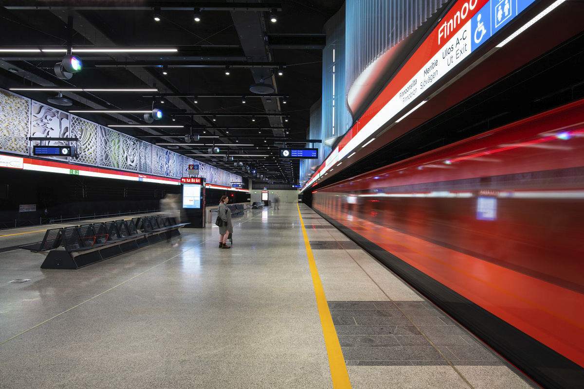 ERCO Kona projectors illuminate art in a Helsinki metro station, enhancing the space.