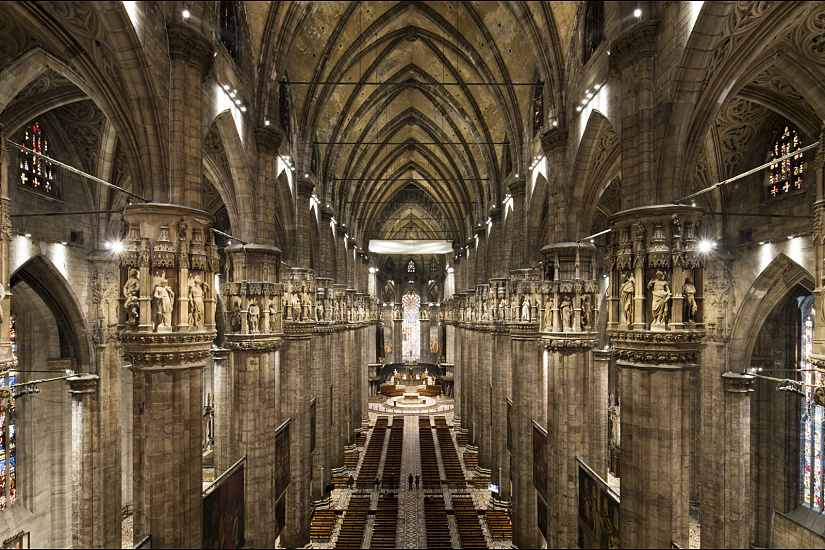 Interior of Milan Cathedral illuminated by ERCO LEDs, highlighting architectural details.