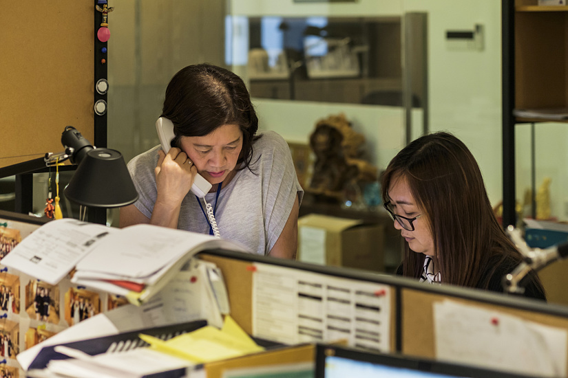 Million Lighting office: Staff on the phone and at a desk.