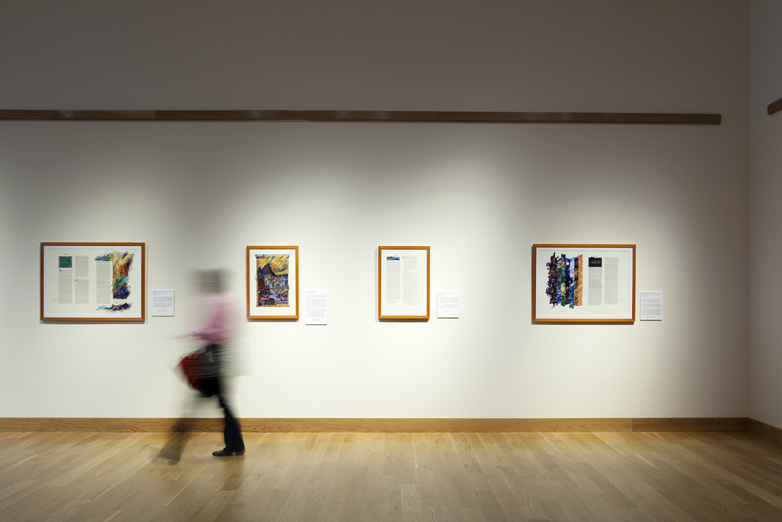Minnesota Marine Art Museum interior featuring artworks illuminated by ERCO lighting, with a visitor.