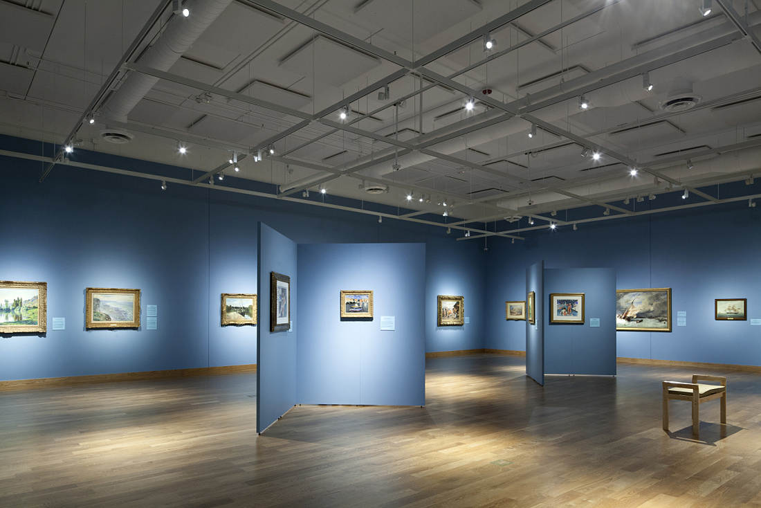 Interior of Minnesota Marine Art Museum illuminated by ERCO Optec spotlights highlighting maritime art.