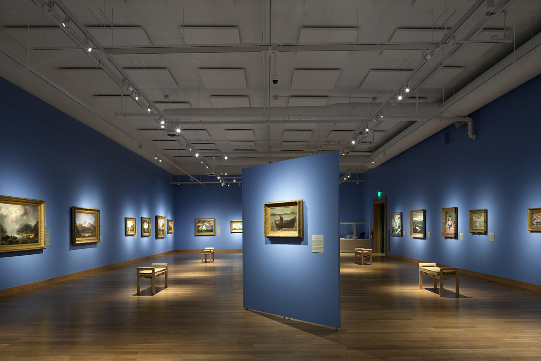 Interior of the Minnesota Marine Art Museum, showcasing art illuminated by ERCO Optec spotlights.