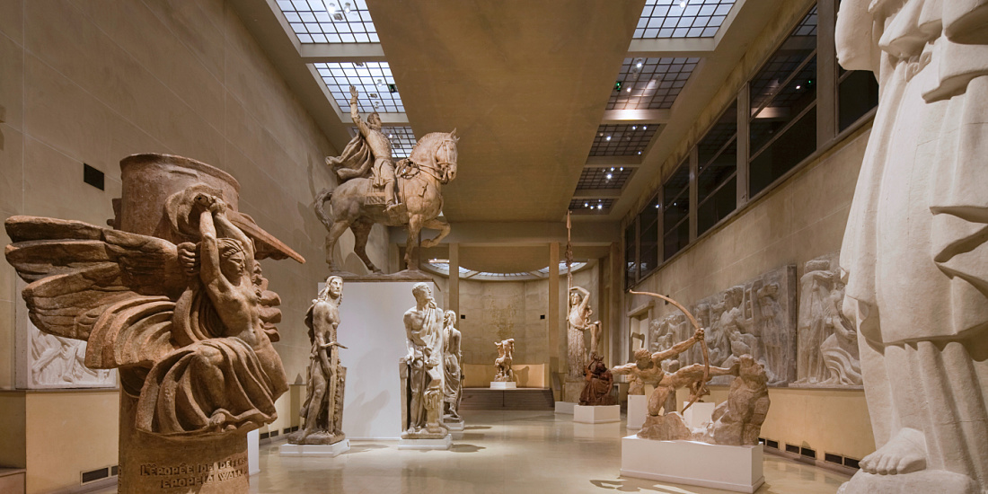 Musée Bourdelle interior featuring sculptures illuminated by ERCO LED lighting.