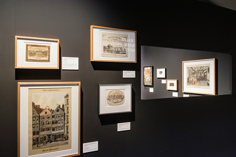 Museum exhibition featuring graphics and ERCO accent lighting highlighting Hamburg's brewing culture.