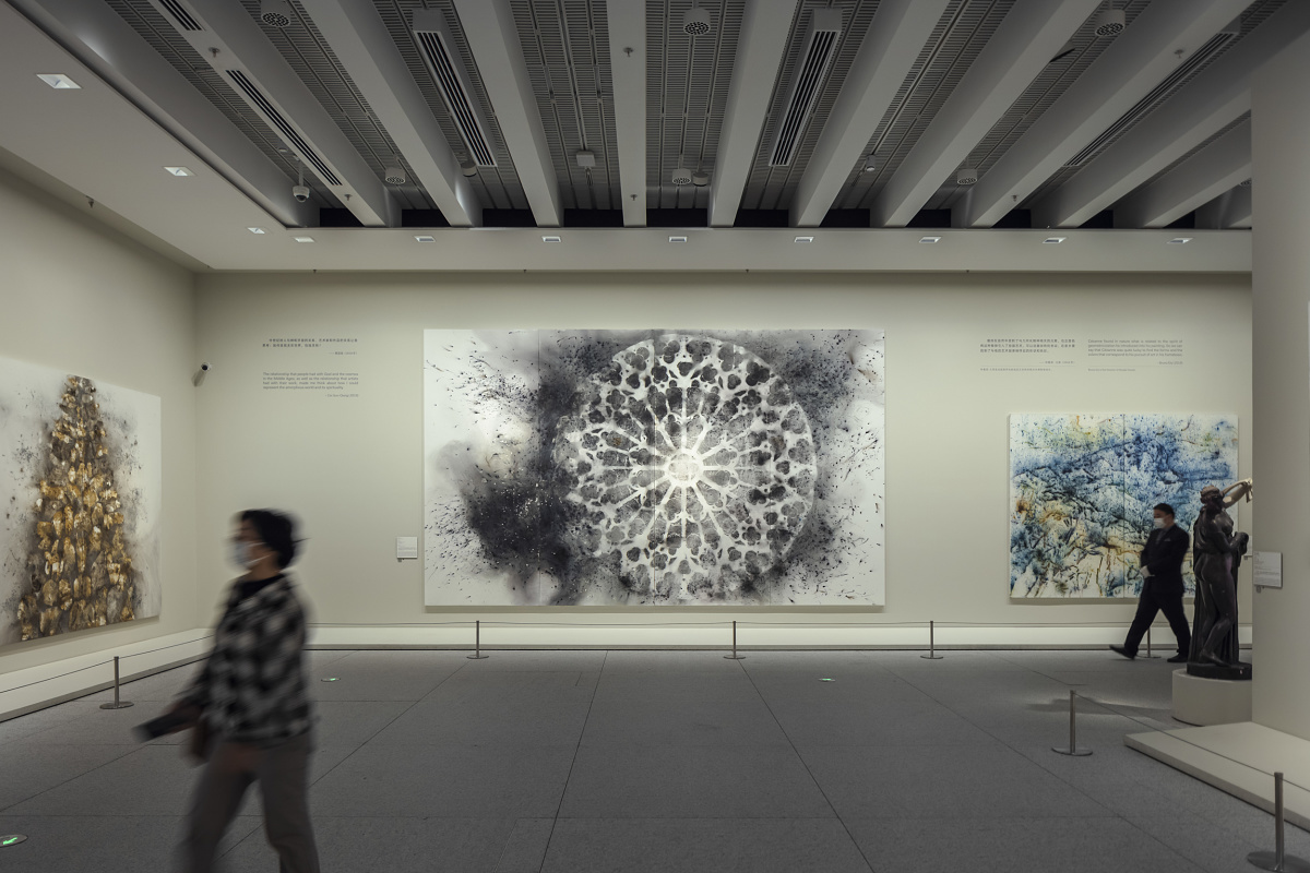 Art exhibition at the Museum of Art Pudong, Shanghai, featuring ERCO LED lighting for high visual comfort.