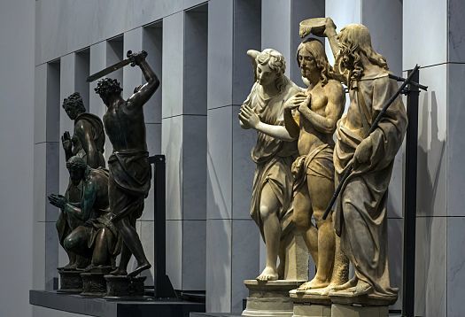 Sculptures in Florences Cathedral Museum, illuminated by ERCO LEDs, enhancing art and history.