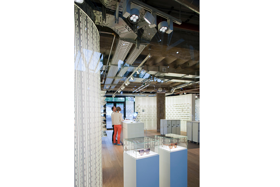 MYKITA store in Berlin featuring ERCO LED spotlights for product presentation.
