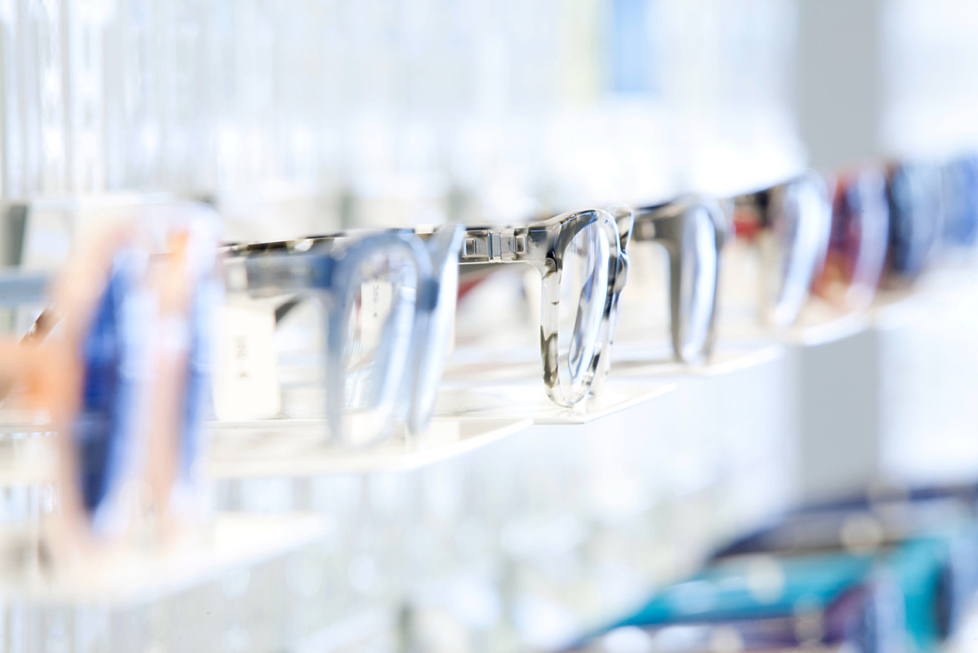 MYKITA eyewear displayed on a shelf in Bikini Berlin concept mall, illuminated by ERCO LED spotlights.