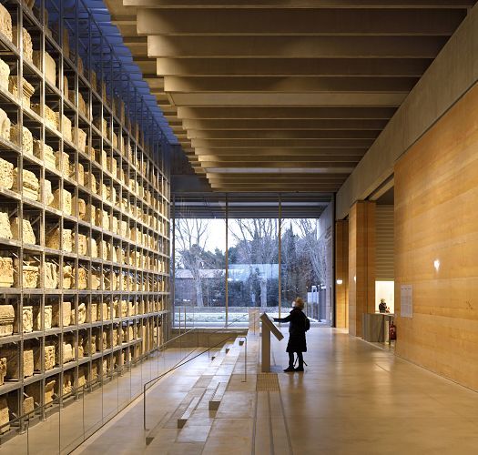 Narbo Via Museum interior featuring ERCO Optec spotlights for flexible artifact lighting.