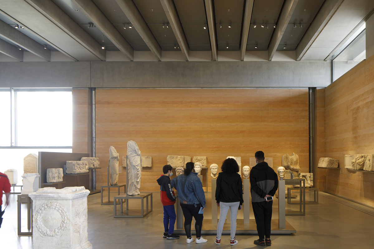 Visitors view Roman artifacts illuminated by ERCO Optec spotlights in the Narbo Via Museum.