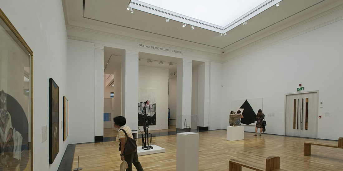 Interior of the National Museum Wales featuring ERCO LED lighting illuminating art pieces.