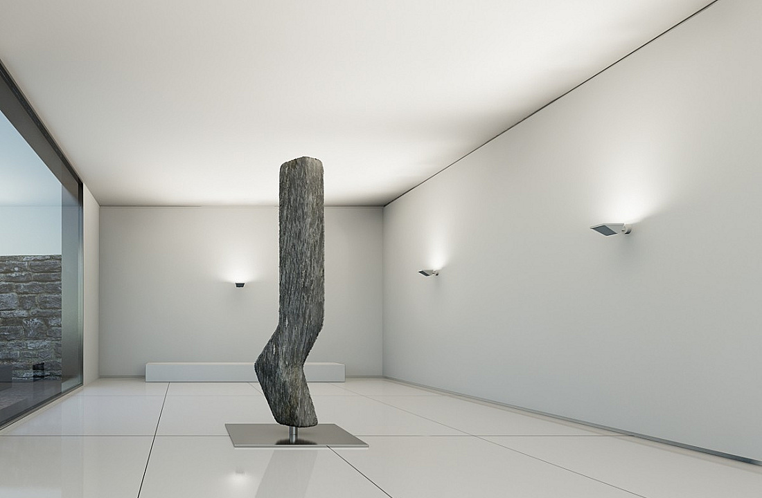Sculpture illuminated by ERCO wallwashers, creating directed light for an atmospheric ambiance.