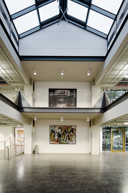 Neubrandenburg University foyer featuring ERCO downlights for efficient lighting.
