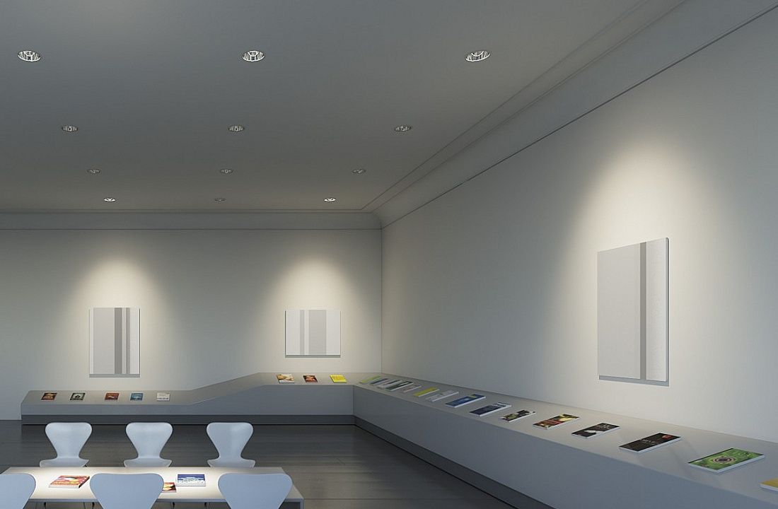 ERCO recessed ceiling luminaires in a neutrally lit exhibition space.