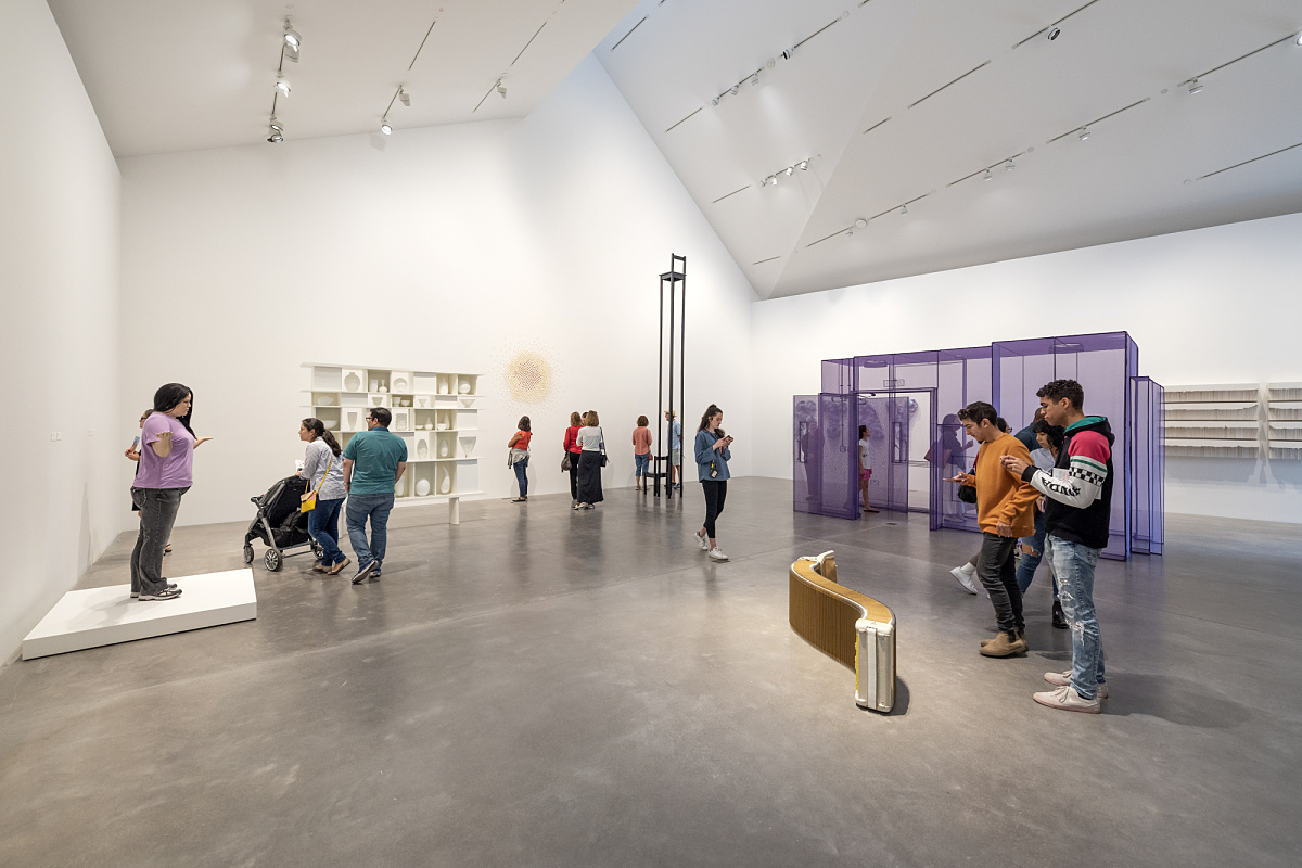 Visitors view art illuminated by ERCO LED spotlights in Ruby City Gallery, Texas.