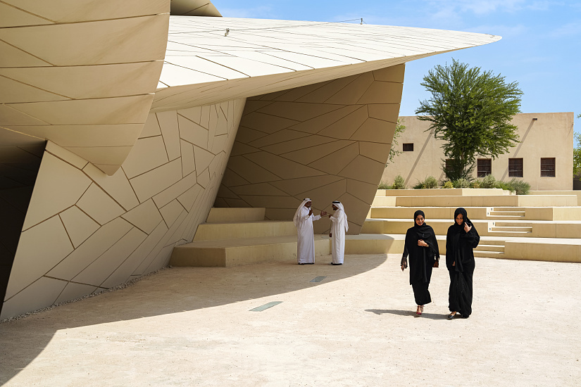 The National Museum of Qatar, illuminated with ERCO light, showcasing its unique architecture.