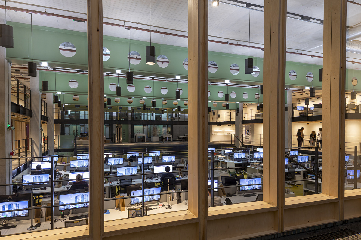 AHMM Architects office in London featuring flexible ERCO Jilly track downlights for office lighting.