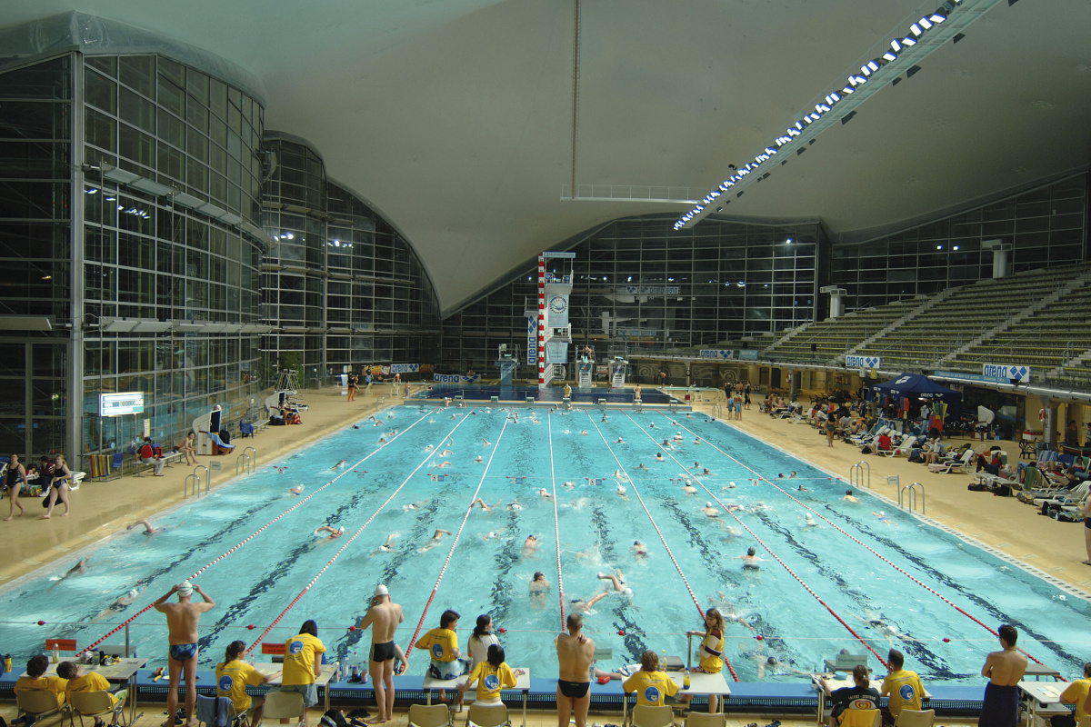 Olympia Schwimmhalle in Munich, illuminated by ERCO Focalflood for competition lighting.